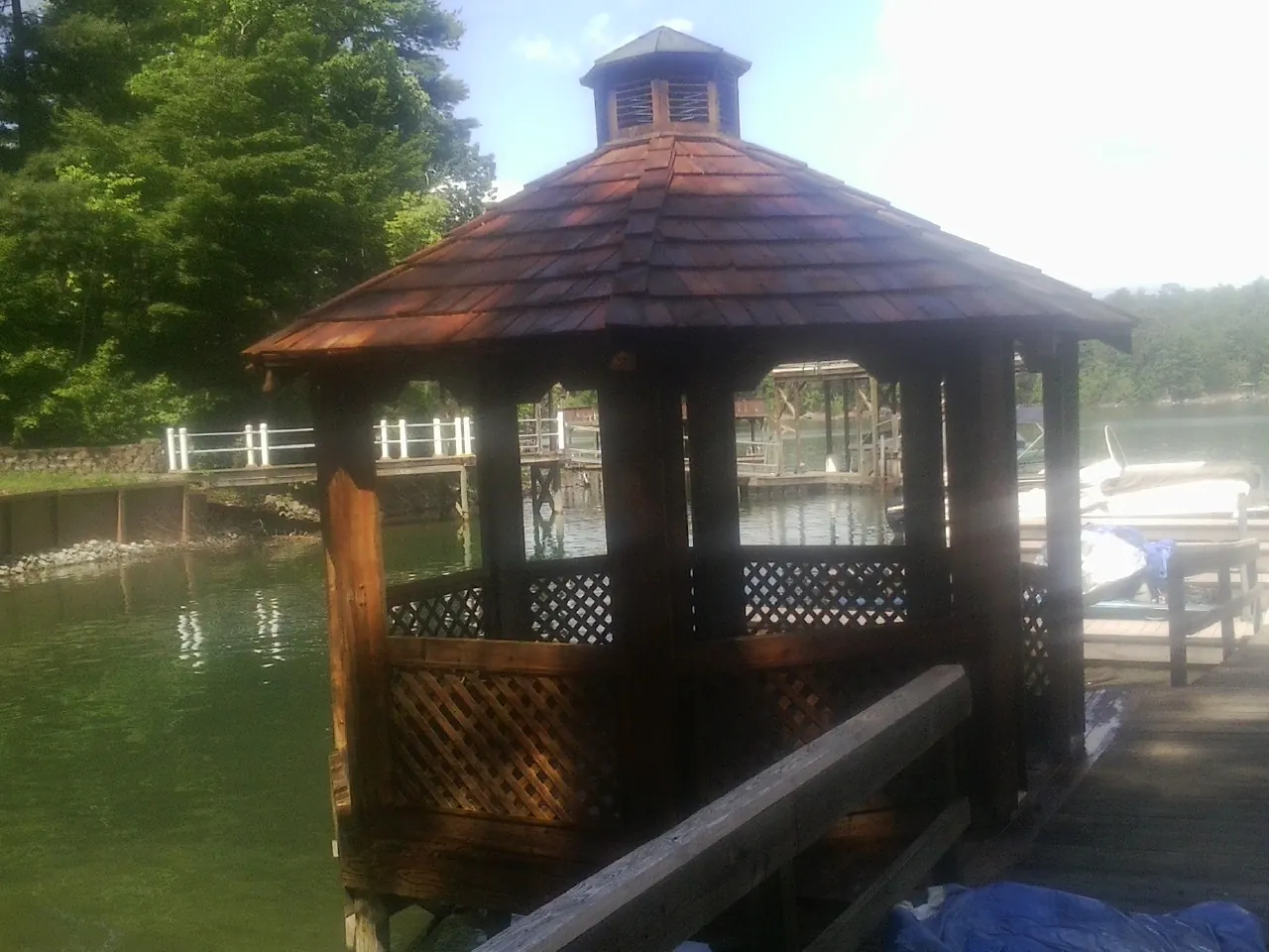 Cedar shake gazebo roof rebuilt on a lake dock in Hooven